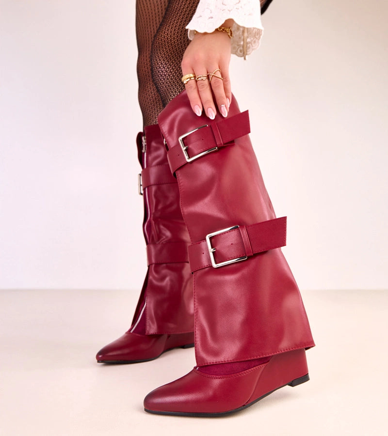 Red wedge boots with decorative buckles by Toadera